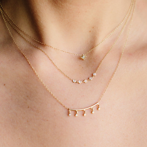 woman wearing Zoë Chicco 14kt Gold 5 Linked Floating Diamonds Necklace