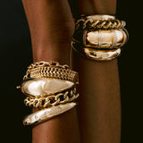 close up of woman's wrist on black background wearing Zoë Chicco 14k Gold Double Wide Curb Chain Bracelet