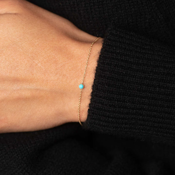 close up of a woman's wrist wearing a Zoë Chicco 14k Gold Turquoise Bezel Chain Bracelet | December Birthstone