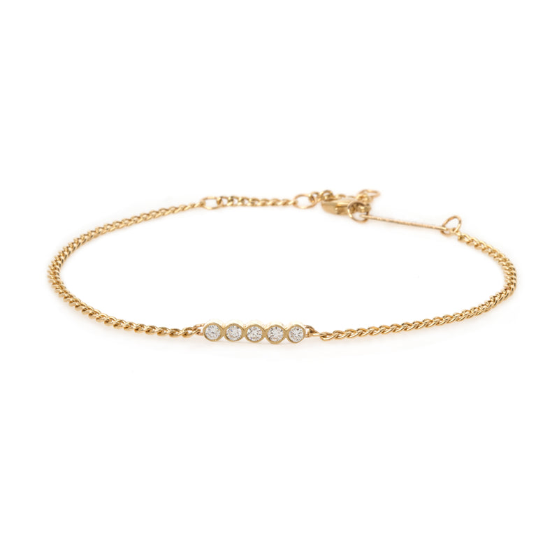 yellow gold curb chain bracelet with 5 bezel diamonds