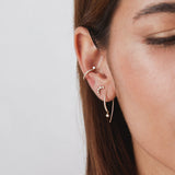 a front close up view of a woman's ear wearing a Zoë Chicco 14k Gold Pavé Diamond Bar Short Threader with Dangling Diamond
