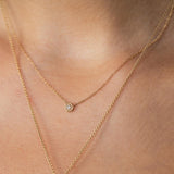 close up of woman wearing a Zoë Chicco 14k Gold Diamond Hexagon Necklace