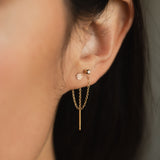close up of woman's ear wearing a Zoë Chicco 14k Gold Itty Bitty Pavé Diamond Disc Threader Earring threaded through two piercings