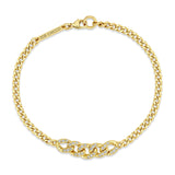 Top down view of a Zoë Chicco 14k Gold Small Curb Chain Bracelet with Pavé Diamond Large Curb Link Station