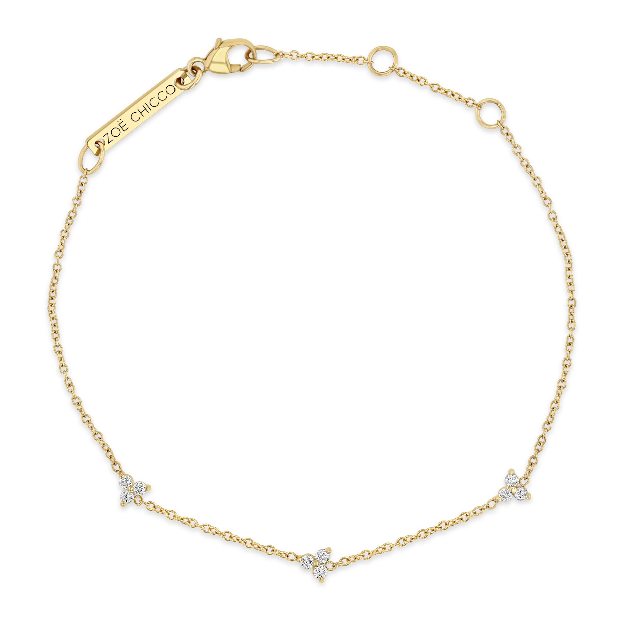 Top down view of a Zoë Chicco 14k Gold 3 Diamond Trio Station Bracelet