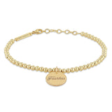 front view of Zoë Chicco 14k Gold Bead Amore Charm Bracelet engraved with Fearless
