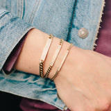 woman's wrist wearing all three sizes of Zoe Chicco 14k Curb Chain Pave Diamond ID Bracelet