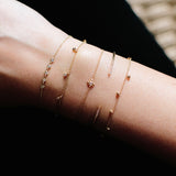 14k 7 Scattered Tiny Gold Bead Bracelet